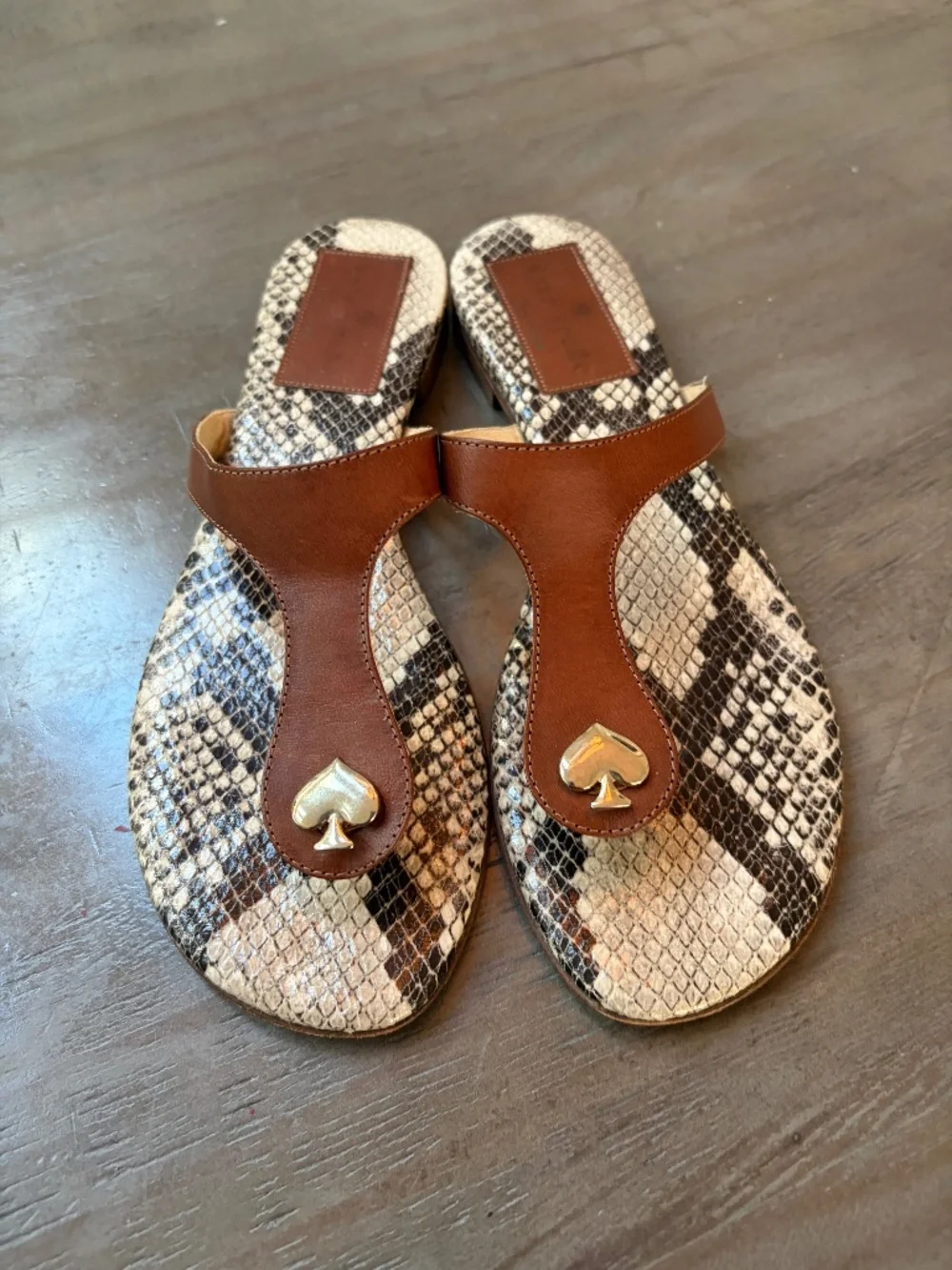 Kate Spade brown leather and snakeskin thong sandals.